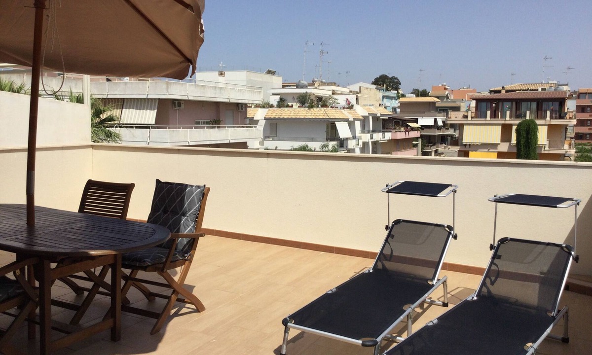 Pozzallo Apartment | Attic, stylishly furnished, large terrace and sea view, 5 min. to the beach.