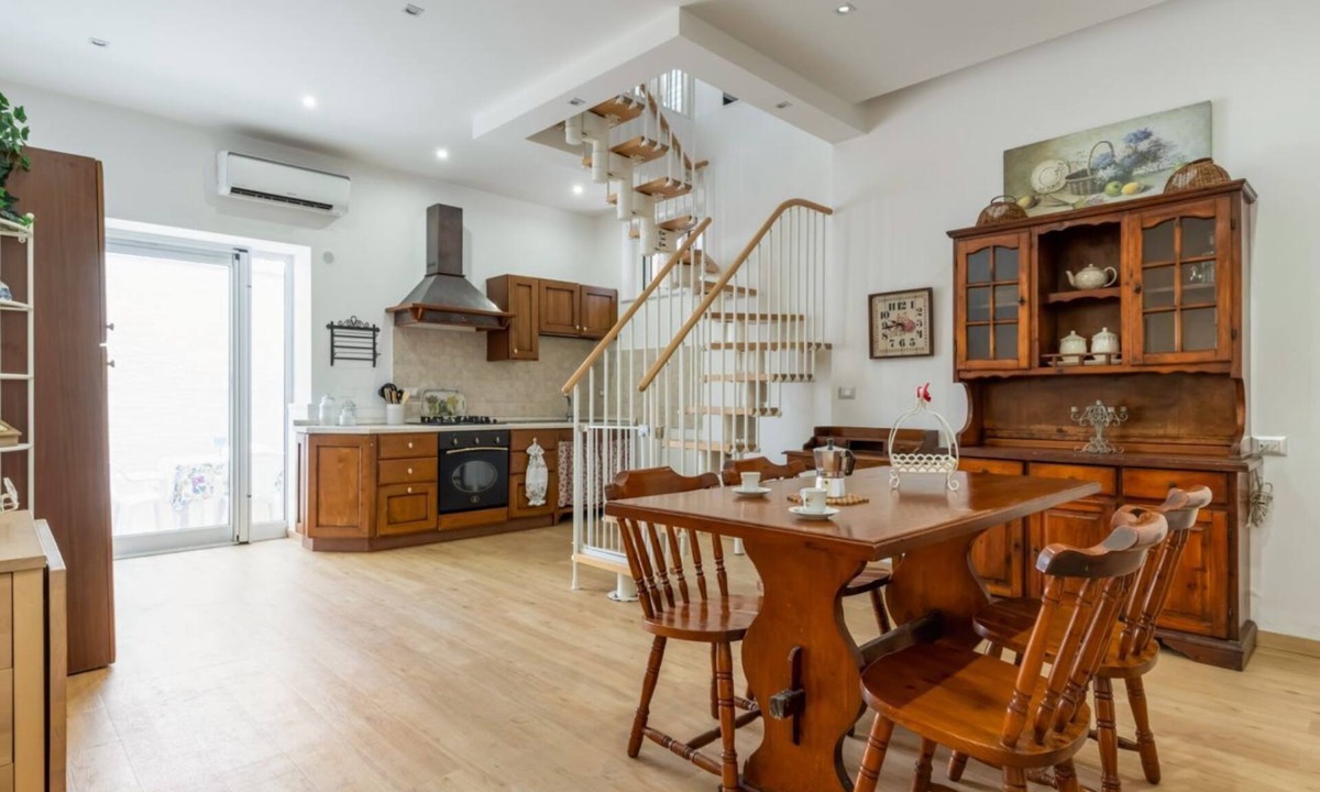 Aci Trezza Apartment | GuestHost - Spacious 120 sqm apartment in Aci Castello, ideal for 6 people. Features a balcony, private garden, and air conditioning. Aci Castello is a picturesque coastal town in Sicily, famous for its charming Norman castle by the sea. Perfect for thos