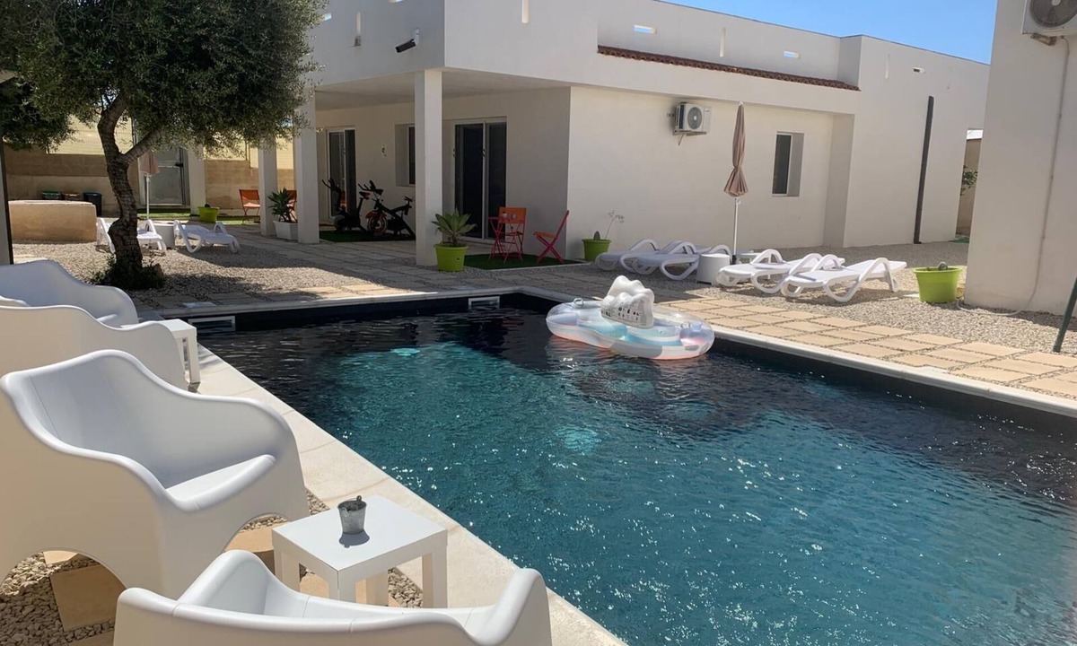 Scoglitti Apartment | The pool and Sicilian sunsets along the coast of Scoglitti.