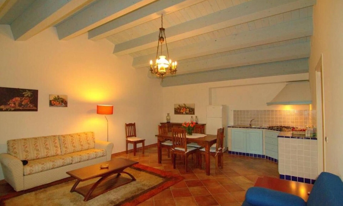 Carruba House | Torre Archirafi Resort -refuge nestled in the green Sicilian countryside.