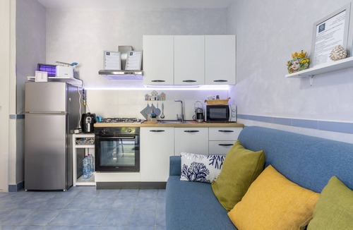 Santa Maria del Focallo Apartment | Apartment 'D R Holiday Home' with Private Garden close to the sea