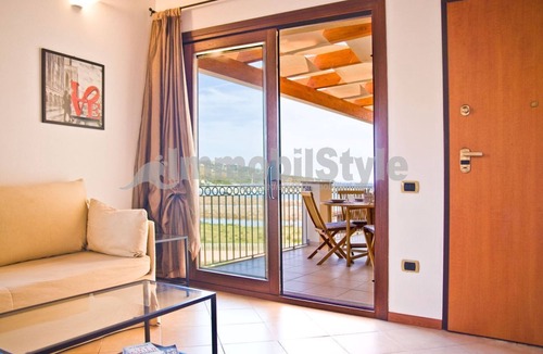 Porto Pozzo Apartment | Apartment with terrace and sea view