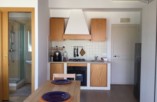 Pozzallo Apartment | Attic, stylishly furnished, large terrace and sea view, 5 min. to the beach.