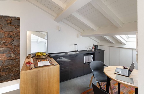 Cannizzaro Apartment | Design Apartment with Terrace by Wonderful Italy