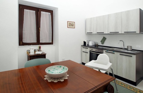 Marina di Caronia Apartment | Dimora Burrafato, known by locals as “La Casa Rossa”, is a historic summer residence once owned by Princess Pignatelli, located directly on the seafront of Caronia. The property consists of three independent units, each with a private entrance, a bal
