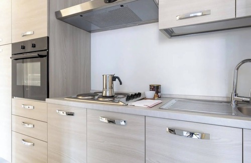 Rione VII Regola Apartment | Elegant Roman Apartment with Rooftop Access & Landmark Views