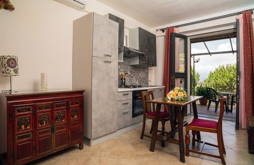 Castelmola Apartment | Holiday Apartment 'Garden Cottage I Dammusi - Arancio' with Mountain View, Shared Pool & Wi-Fi