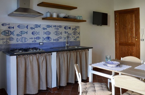 Santo Stefano di Camastra Apartment | Anemone is an independent apartment consisting of an equipped kitchen-living room with a single sofa bed, a double bedroom overlooking the main square and the sea, and a bathroom made of handmade ceramic, equipped with a washing machine. The accommodatio