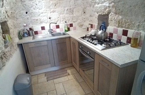 San Michele Salentino Villa | Secluded Trulli, huge patio, extra large pool, wood pizza oven and barbeque area