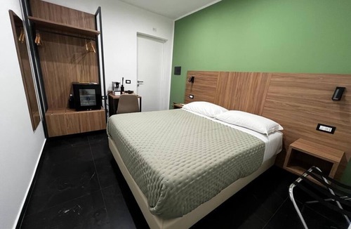 Acate Hotel | Tenuta Macconi Country Rooms, nestled in a lush citrus grove near the sea.