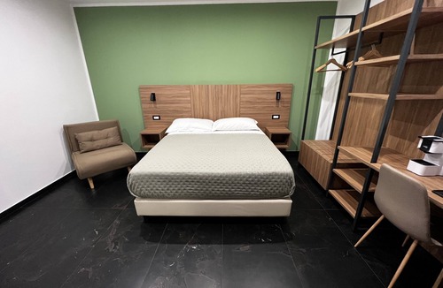 Acate Hotel | Tenuta Macconi Country Rooms, nestled in a lush citrus grove near the sea.