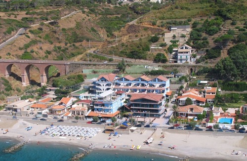 Province of Messina House | Vacation Home "Oasi Azzurra - Bilocale Plus 2" with Sea View, Shared Pool & Shared Terraces
