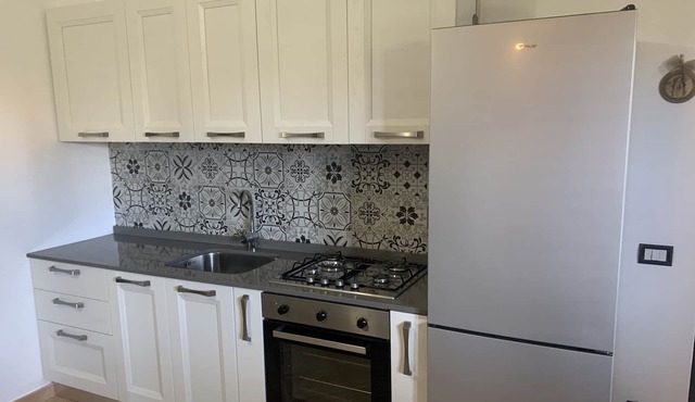 Beautiful beach front apartment with large private garden in a gated development