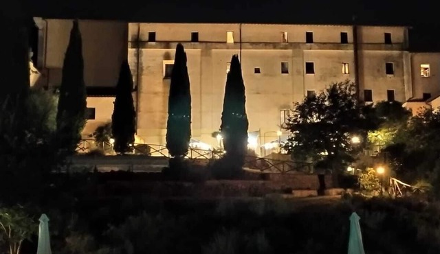 Former monastery surrounded by greenery with bright apartments, swimming pool, restaurant