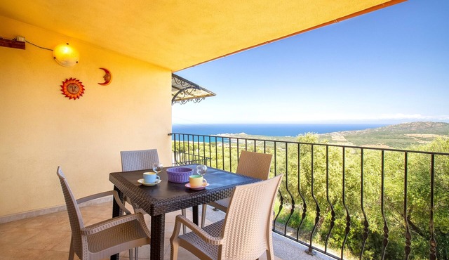 Sea View Isola Rossa Apartment with Sea View, Wi-Fi, and Air Conditioning