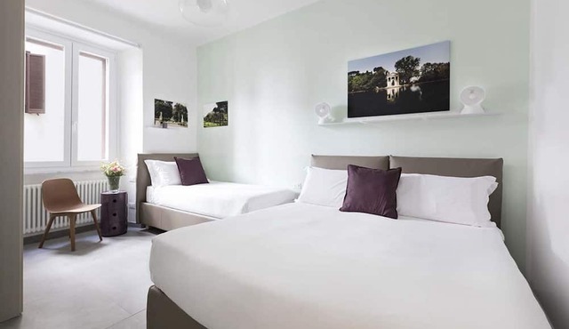 The apartment is located on the 1st floor (with elevator) of a residential building built in the 19th century in Via Marche. It was completely renovated in 2018 using high-quality materials. The design is minimalist and modern. The interior design vers